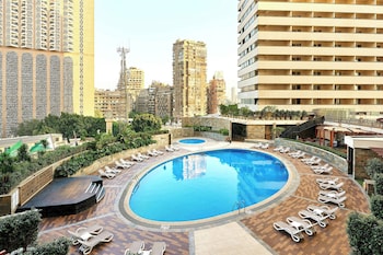 Deluxe Guest room, 1 King, Pool & City view, Balcony