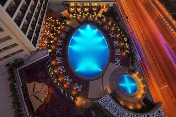 Deluxe Guest room, 1 King, Pool & City view, Balcony