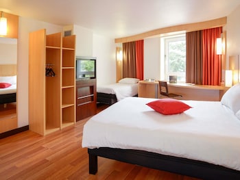 Accessible room with a double bed and a single bed